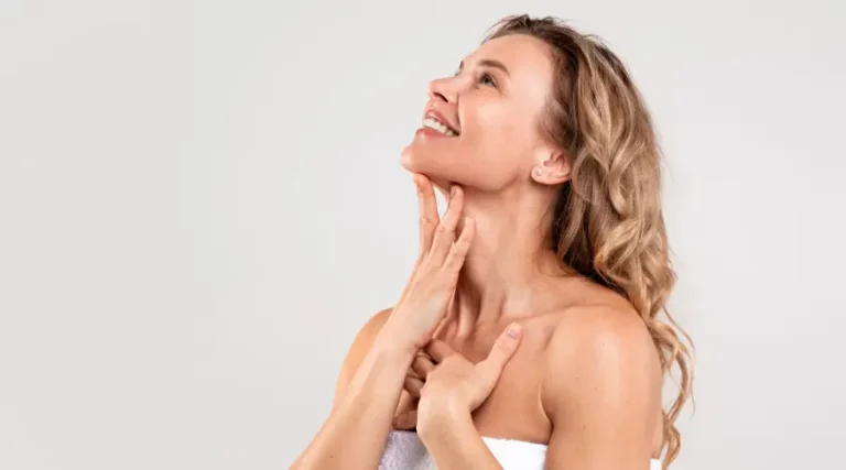 women touch her neck_Best Age for Sculptra